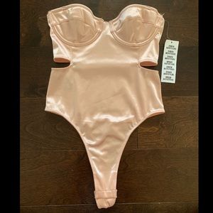 urban outfitters pink bodysuit!